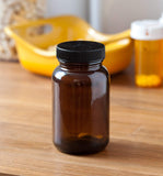 Amber Glass Packer Bottle with Black Ribbed Lid - 5 oz / 150 ml