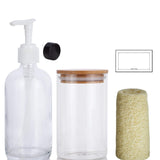 10 Piece Set 16 oz Clear Glass Boston Round Bottles (6) with White Lotion Pump and Phenolic Caps, 16 oz Clear Jars with Bamboo Lids (2), Loofahs (2), Labels (8)