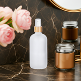 Frosted Clear Glass Boston Round Bottle with Gold Fine Mist Sprayer (12 Pack)