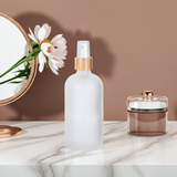 Frosted Clear Glass Boston Round Bottle with Gold Fine Mist Sprayer (12 Pack)