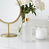 Frosted Clear Glass Boston Round Bottle with Gold Fine Mist Sprayer (12 Pack)