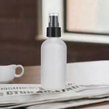 (12 PACK) 4 oz Frosted Clear Glass Bottles with Black Treatment Pump - JUVITUS