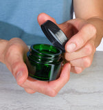 (12 Pack) 1 oz Green Glass Thick Wall Balm Jars with Black Smooth Foam Lined Lids