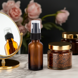 Amber Glass Boston Round Bottle with Black Treatment Pump (12 Pack)