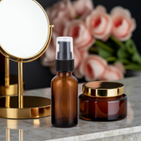 Amber Glass Boston Round Bottle with Black Treatment Pump (12 Pack)