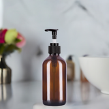 (12 pack) 8 oz Amber Boston Round Glass Bottle with Black Lotion Pump and Phenolic Cap - JUVITUS