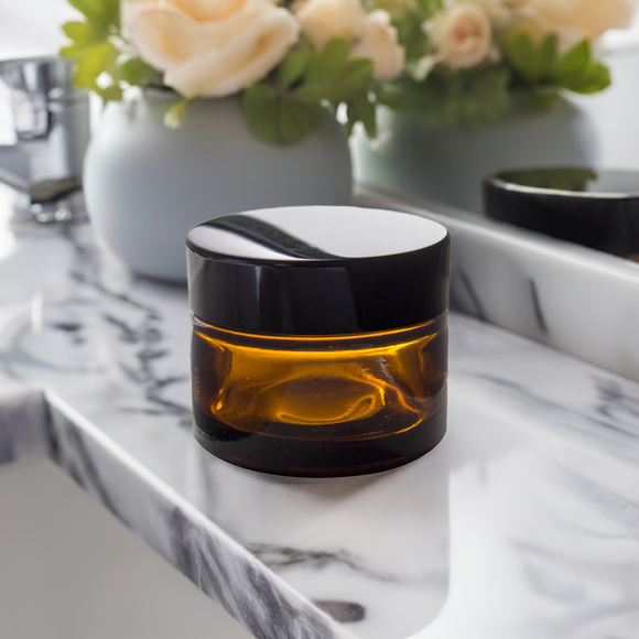 (24 Pack) 1.35 oz Amber Glass Balm Jars with Black Smooth Lids
