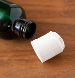Green Plastic Boston Round Bottle with White Disc Cap - 4 oz / 120 ml