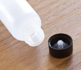 Natural Clear Plastic Squeeze LDPE Bottle with Black Phenolic Cap - 1 oz / 30 ml