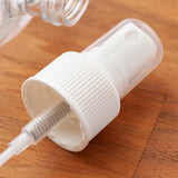 1 oz White Plastic HDPE Boston Round Graduated Bottle with White Fine Mist Sprayer (12 Pack)