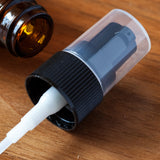 Amber Plastic PET Boston Round Bottle with Black Treatment Pump (12 Pack) - JUVITUS