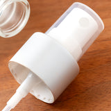 Clear Plastic PET Boston Round Bottle with Silver Fine Mist Sprayer (12 Pack)