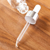 1 oz / 30 ml Clear Glass Boston Round Bottle with Silver Metal and Glass Dropper